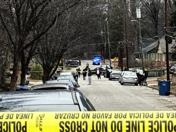 Atlanta police blocked off Holderness Street in the West End neighborhood to investigate a fatal shooting.