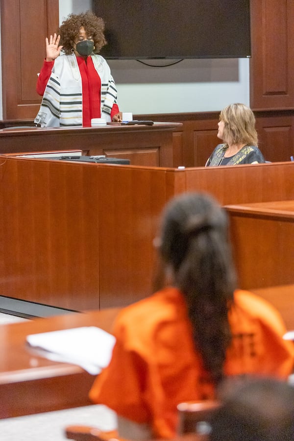 Nazarie Romain Anderson, the mother of Black Hammer leader Augustus Claudius Romain Jr., known as Gazi Kodzo, is sworn in during his hearing at the County Justice Center in Fayetteville Wednesday, August 17, 2022. Steve Schaefer/steve.schaefer@ajc.com)