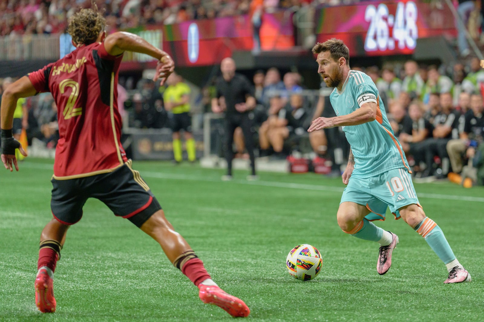 Inter Miami forward Lionel Messi (10) dribbles the ball during the first half of a soccer match against Atlanta United, Saturday, Nov. 2, 2024, in Atlanta. (AP Photo/Jason Allen)