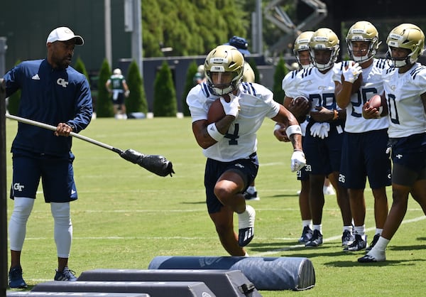 Georgia Tech's running back Dontae Smith (4) runs a drill during a training camp at Georgia Tech’s Rose Bowl Field, Tuesday, August 1, 2023, in Atlanta. Smith is on the official watch list for the Doak Walker Award, which annually honors college football’s top running back. (Hyosub Shin / Hyosub.Shin@ajc.com)