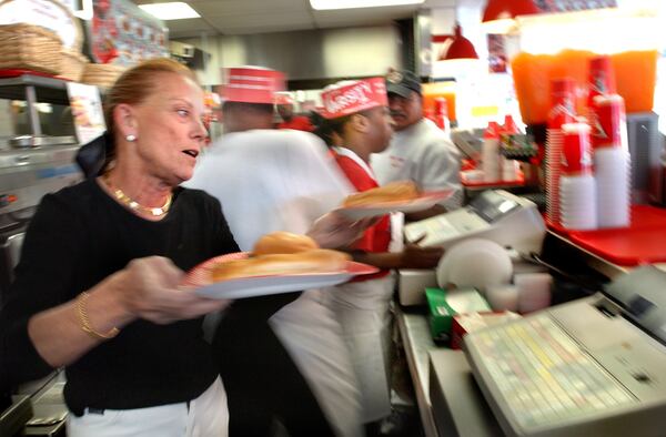 031001 - ATLANTA, GA -- Susan Gordy (cq), the owner of the Varsity Jr., at work behind the counter filling orders. Susan has run the Jr. since 1980, when her husband, Frank Gordy Jr. (son of Varsity founder Frank Gordy) was killed in a shooting accident. (JOEY IVANSCO/AJC staff)