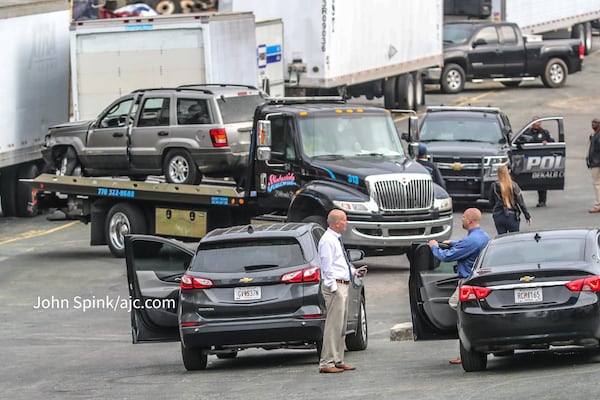 A gray Jeep Cherokee with front-end damage was towed from a scene on Chupp Road connected to the officer-involved shooting.