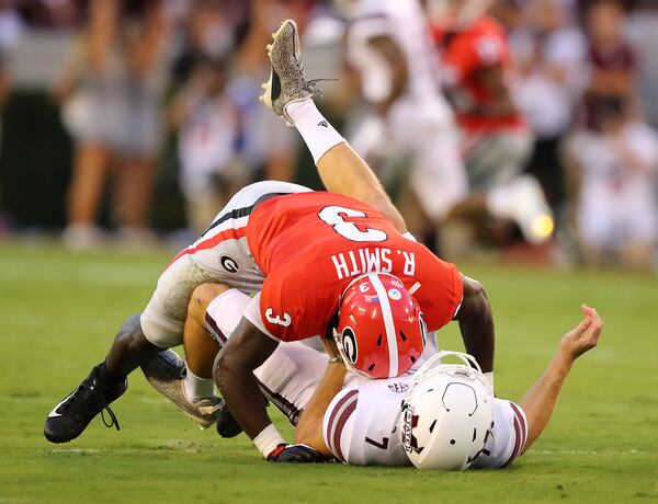 Georgia linebacker Roquan Smith levels Mississippi State quarterback Nick Fitzgerald during the September SEC matchup in Athens. Curtis Compton/ccompton@ajc.com