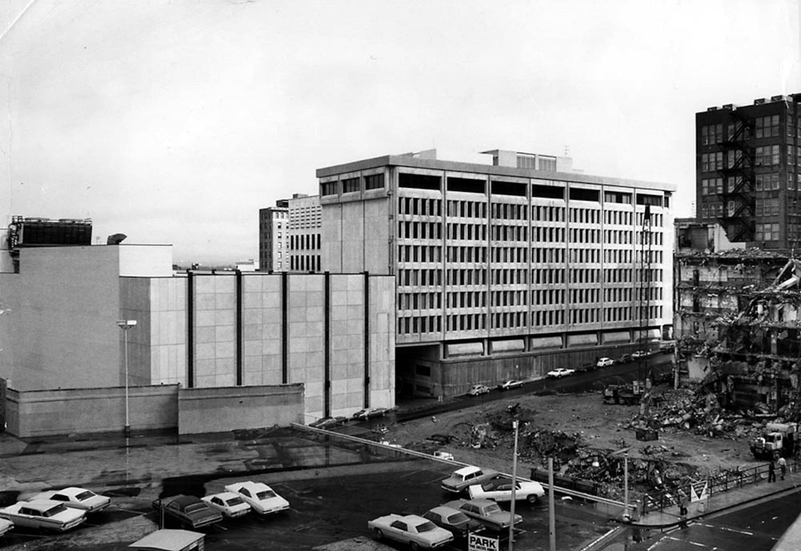 The new home for the Journal and Constitution can be seen in the background as the 10 Forsyth building is demolished in front. (Bill Mahan/AJC file)