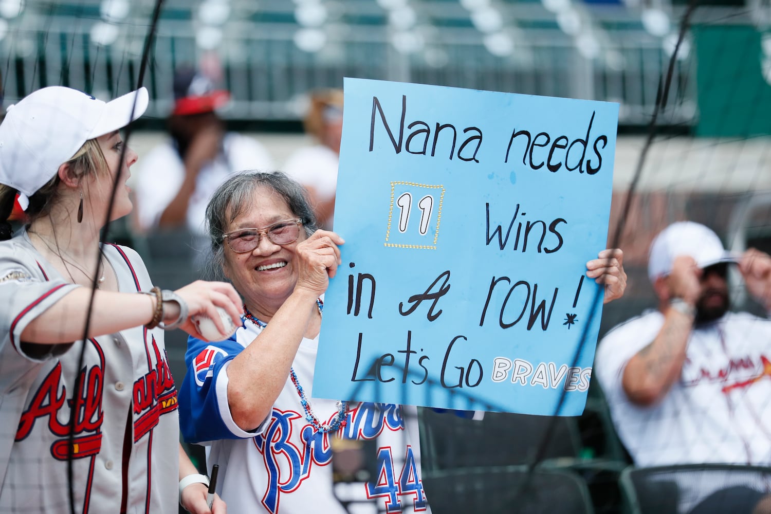 A Braves fan shows support with a special request for the team to continue the winning streak Sunday, June 12, 2022, in Atlanta. (Miguel Martinez / miguel.martinezjimenez@ajc.com)