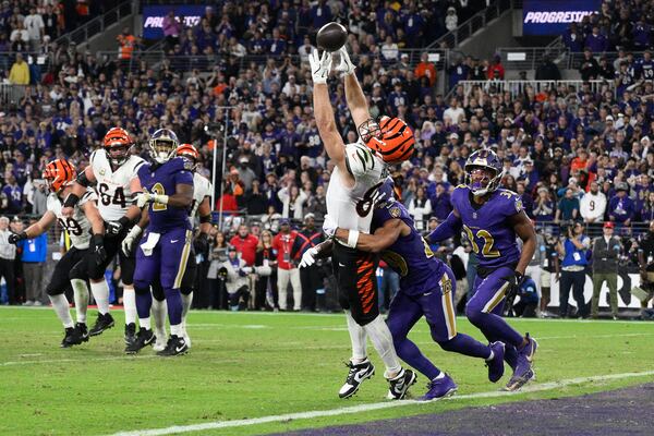 Cincinnati Bengals tight end Tanner Hudson (87) misses a two-point conversion as Baltimore Ravens safety Ar'Darius Washington (29) defends and Baltimore Ravens safety Marcus Williams (32) looks on during the second half of an NFL football game, Thursday, Nov. 7, 2024, in Baltimore. (AP Photo/Nick Wass)