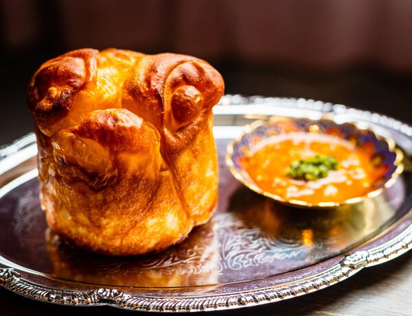 Kubaneh (Yemeni pull-apart rolls) with schug (a spicy tomato-based hot sauce) at Aziza. CONTRIBUTED BY HENRI HOLLIS