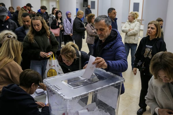 People cast their ballots in a Republican People's Party or (CHP) polling station during a symbolic election to show solidarity with Istanbul's Mayor Ekrem Imamoglu after he was arrested, in Istanbul, Turkey, Sunday, March 23, 2025. (AP Photo/Huseyin Aldemir)