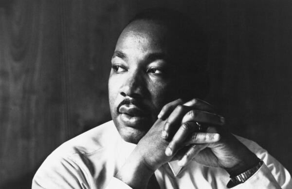 Martin Luther King Jr. listens to other staff members of SCLC during a meeting at an Atlanta restaurant. (Photo by © Flip Schulke/CORBIS/Corbis via Getty Images)