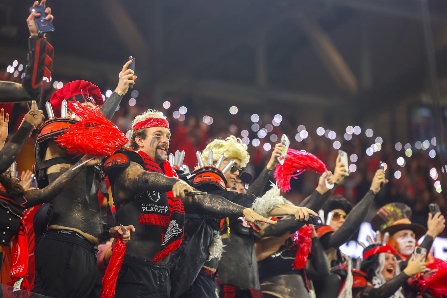 Georgia Bulldogs fans react after a scored against the TCU Horned Frogs during the second half of the College Football Playoff National Championship at SoFi Stadium in Los Angeles on Monday, January 9, 2023. Georgia won 65-7 and secured a back-to-back championship. (Jason Getz / Jason.Getz@ajc.com)