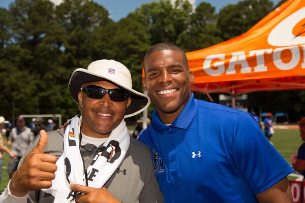 Cam Newton and his dad, Cecil Newton Sr. Photo: Tomas Espinosa