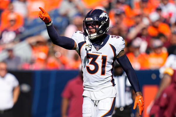 Denver Broncos safety Justin Simmons (31) lines up against the Washington Commanders during an NFL football game Sunday, Sept. 10, 2023, in Denver. (AP Photo/Jack Dempsey)