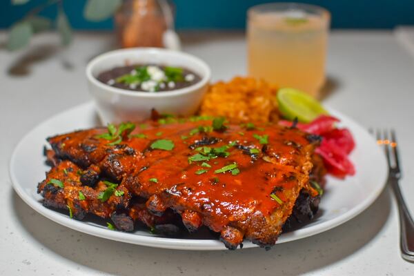 The ribs come slathered with an agave lime barbecue sauce at Birdcage in Grant Park. Courtesy of Liz Attaway/@adventuresinatlanta