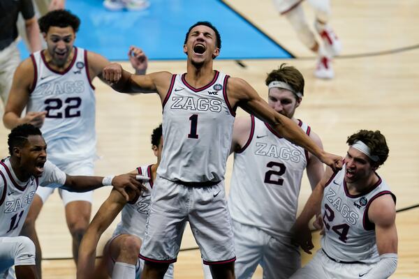 Gonzaga guard Jalen Suggs (1) celebrates making the game winning basket against UCLA during overtime in a men's Final Four NCAA college basketball tournament semifinal game, Saturday, April 3, 2021, at Lucas Oil Stadium in Indianapolis. Gonzaga won 93-90. (AP Photo/Michael Conroy)