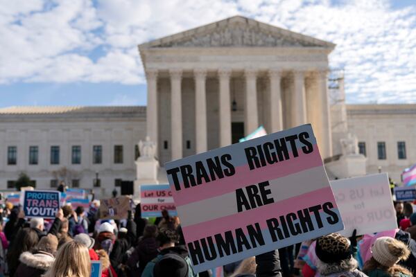 Transgenders rights supporters rally outside of the Supreme Court, Wednesday, Dec. 4, 2024, in Washington. (AP Photo/Jose Luis Magana)