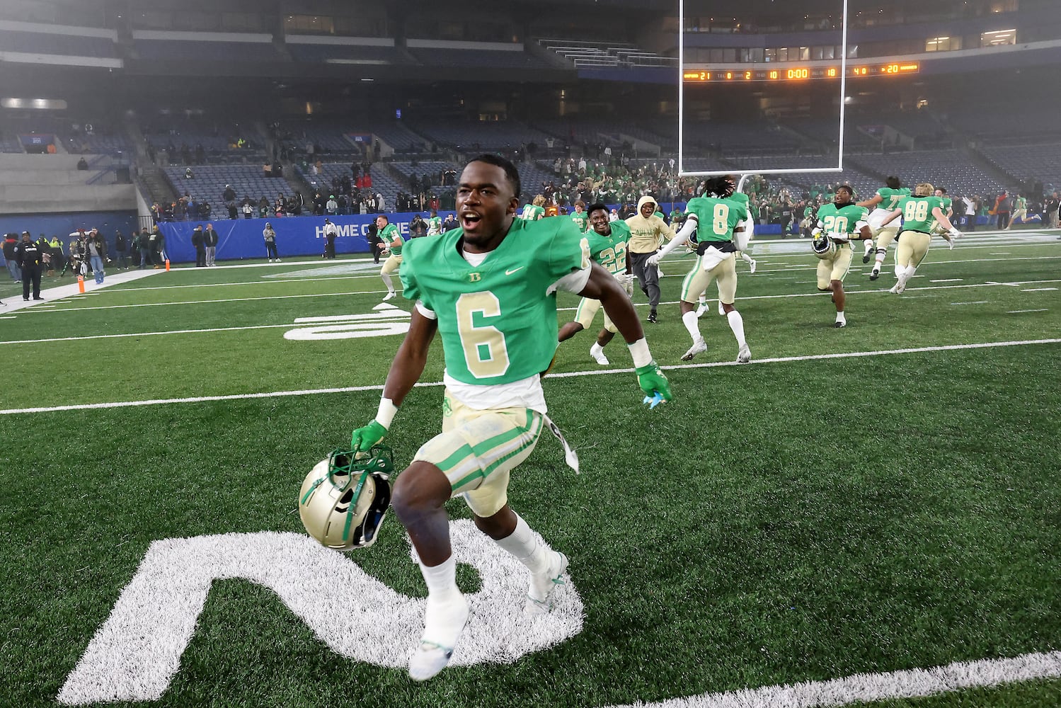 Buford's Victor Venn (6) celebrates after Langston Hughes missed the field goal attempt as Buford won 21-20 as time expires during the Class 6A state title football game at Georgia State Center Parc Stadium Friday, December 10, 2021, Atlanta. JASON GETZ FOR THE ATLANTA JOURNAL-CONSTITUTION