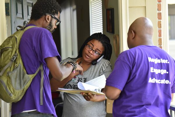 Rodney King (left), volunteer with New Georgia Project and Corbin Spencer (right), field director of New Georgia Project, help Rueke Uyunwa registering to vote for the District 6 runoff on Wednesday, May 17, 2017. The rush is on to register voters in Georgia's 6th district, following a judge's decision to reopen registration as part of a lawsuit against the state. It's the latest in a series of lawsuits and street-level actions by liberal groups and civil rights organizations like the NAACP and the ACLU to push for more open access to the ballot box. HYOSUB SHIN / HSHIN@AJC.COM