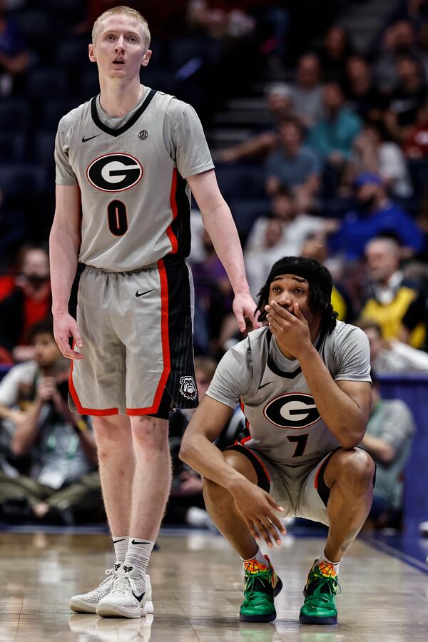 Georgia's Blue Cain (0) and Tyrin Lawrence (7) stand on the court during the second half of an NCAA college basketball game against Oklahoma at the Southeastern Conference tournament, Wednesday, March 12, 2025, in Nashville, Tenn. (AP Photo/Wade Payne)