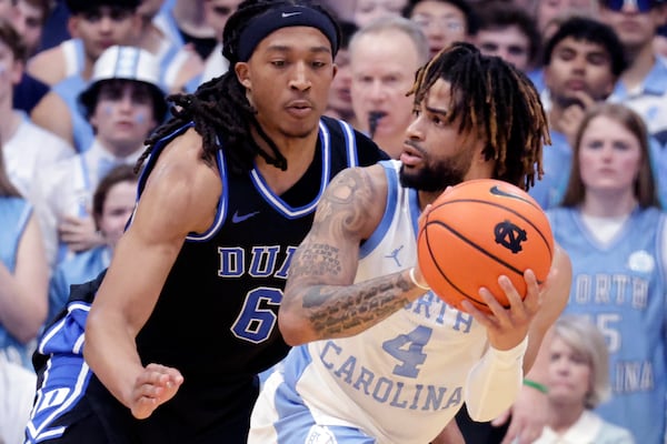 Duke forward Maliq Brown (6) defends North Carolina guard RJ Davis (4) during the second half of an NCAA college basketball game Saturday, March 8, 2025, in Chapel Hill, N.C. (AP Photo/Chris Seward)