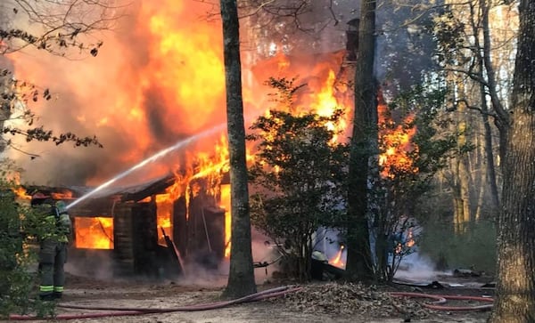 Photos of the blaze shared by the sheriff's office showed the log cabin completely engulfed in flames.