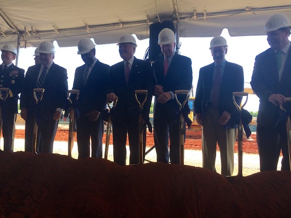 Gov. Nathan Deal, center, and Augusta dignitaries turn some ceremonial dirt for the future Georgia Cyber Innovation and Training Center in downtown Augusta. The event occurred Monday, June 19, 2017, at the Augusta University downtown riverfront campus. J. SCOTT TRUBEY/strubey@ajc.com