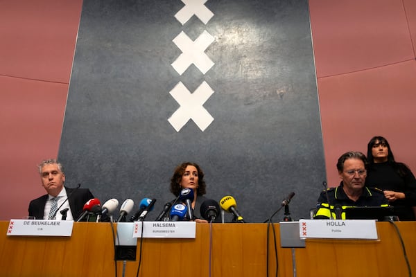 Amsterdam's Mayor Femke Halsema, centre, acting Amsterdam police chief Peter Holla, left, and head of the Amsterdam public prosecutor's office René de Beukelaer hold a news conference after Israeli fans and protesters clashed overnight after a soccer match, in Amsterdam, Netherlands, Friday Nov, 8, 2024. (AP Photo/Mike Corder)