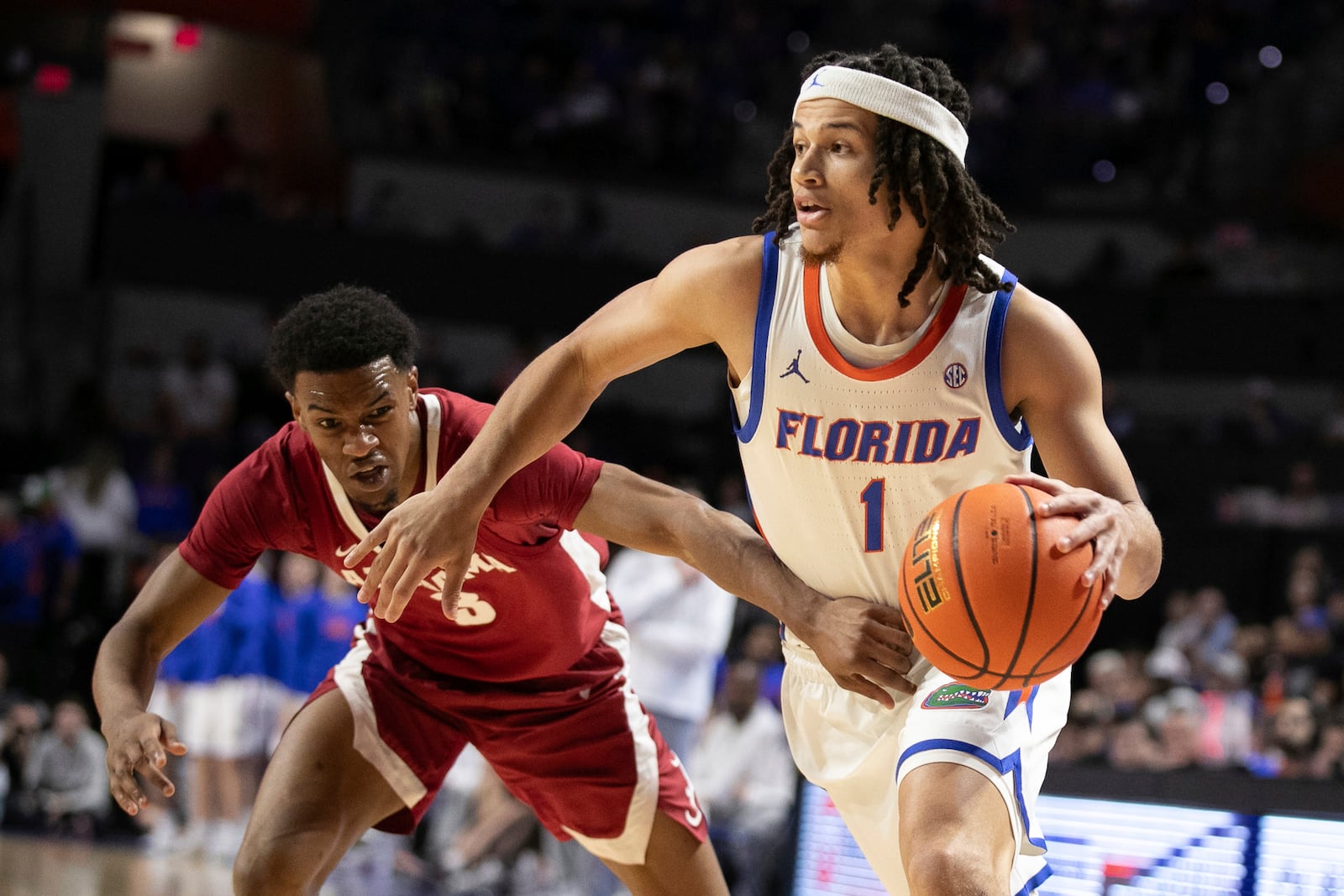 FILE - Florida guard Walter Clayton Jr. (1) gets by Alabama guard Rylan Griffen (3) during the first half of an NCAA college basketball game Tuesday, March 5, 2024, in Gainesville, Fla. (AP Photo/Alan Youngblood, Fiole)