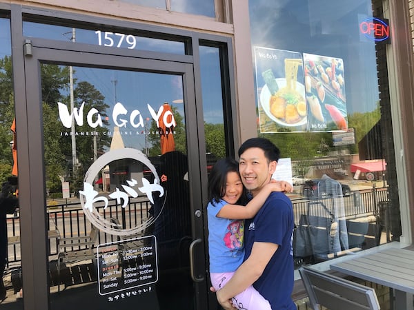 Chef Takashi Otsuka with his daughter Julia in front of his restaurant, Wagaya. COURTESY OF TAKASHI OTSUKA