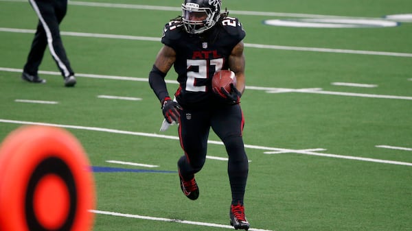 Atlanta Falcons running back Todd Gurley (21) runs the ball in the second half against the Dallas Cowboys Sunday, Sept. 20, 2020, in Arlington, Texas. (Michael Ainsworth/AP)