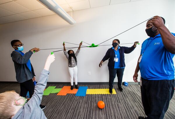 Inspire Brands, the multi-brand restaurant company whose headquarters is in Dunwoody, opened its Young Achievers Academy on the 11th floor of its office building where educators and children interact Wed. Oct. 21, 2020.  The company allows employees to bring their children for virtual learning school days, art actives, exercising and social interactions. (Jenni Girtman for The Atlanta Journal-Constitution)