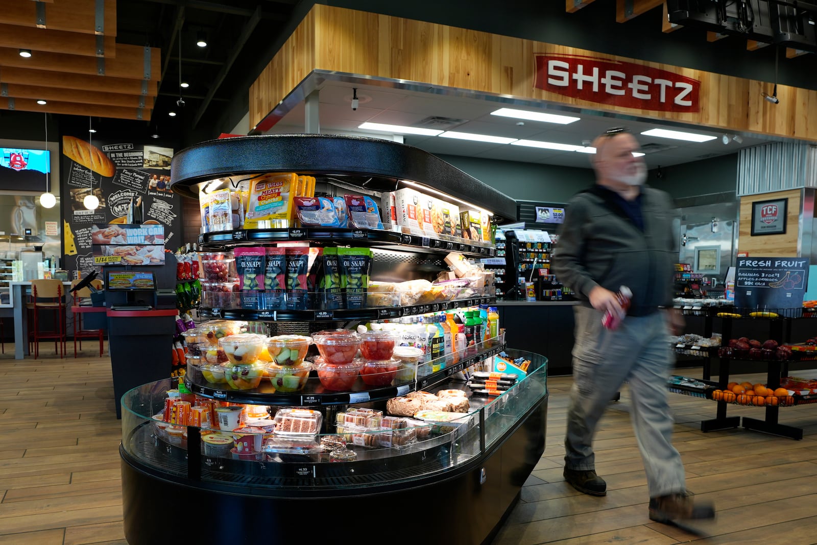 A customer walks through a Sheetz convenience store, Thursday, Oct. 17, 2024, in Bethlehem, Pa. (AP Photo/Matt Slocum)