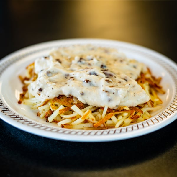 Country hash browns from Waffle House with sausage gravy.