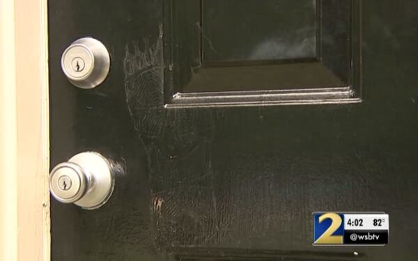 A footprint can still be seen on the door where the alleged break-in happened. (Credit: Channel 2 Action News)