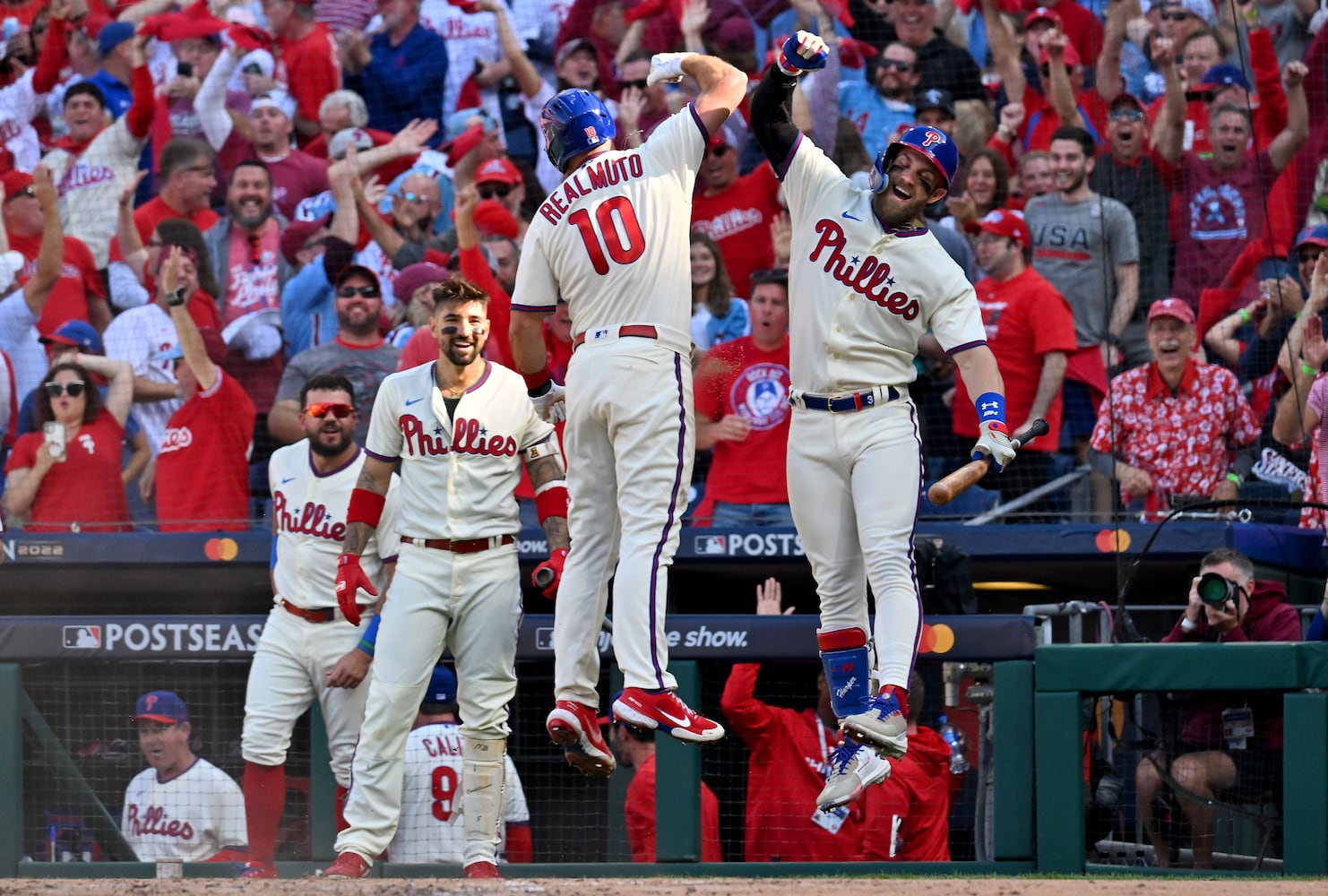 Phillies catcher J.T. Realmuto (10) celebrates an inside-the-park home run against the Braves during the third inning Saturday in Game 4 of the NLDS. (Hyosub Shin / Hyosub.Shin@ajc.com)