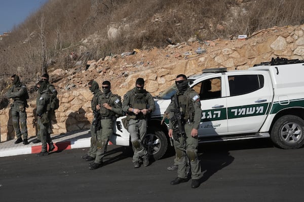 Border Police stand guard as Palestinian citizens of Israel march against Israel's military operations in the Gaza Strip, in Umm al-Fahm, Israel, Friday, Nov. 15, 2024. (AP Photo/Mahmoud Illean)