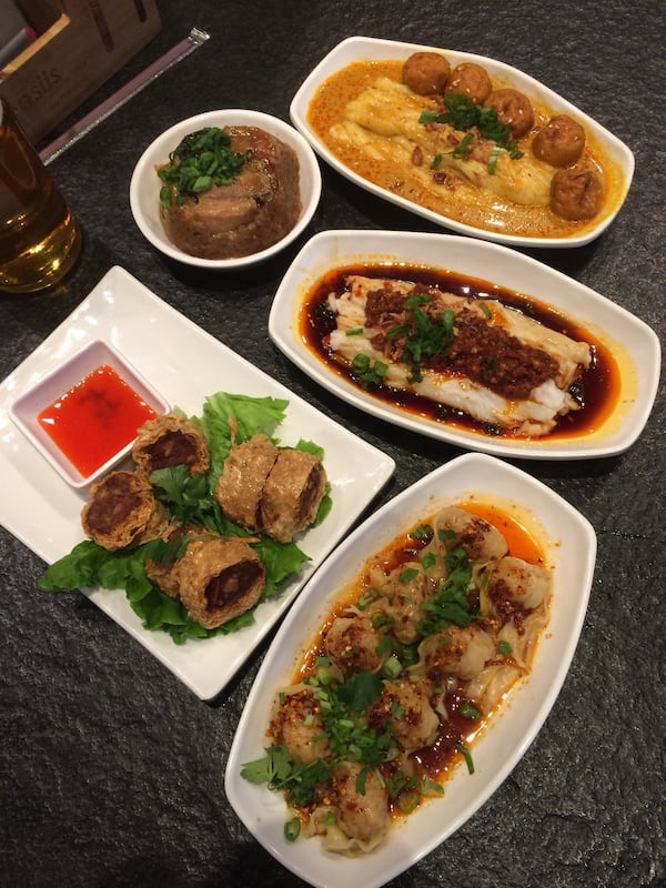 At Food Terminal you can find a selection of dim sum dishes that are Chinese in style. Clockwise from top right: cheong fun with fish balls and curry; cheong fun with Thai chili chicken; Szechuan steamed wontons, five-spice shrimp spring rolls; and nuomiji (sticky rice). PHOTO CREDIT: Wendell Brock