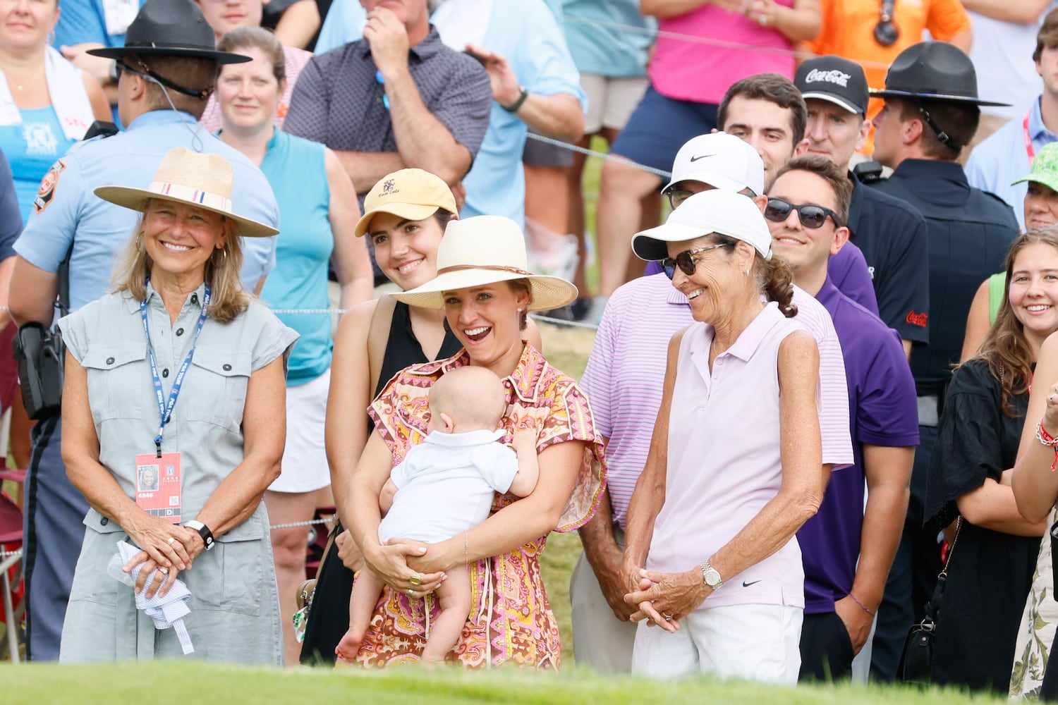 Scottie Scheffler’s family, with his wife Meredith holding their baby, celebrates and reacts during the FedEx Cup trophy presentation after winning the Tour Championship at East Lake Golf Club on Sunday, Sept. 1, 2023, in Atlanta.

(Miguel Martinez / AJC)