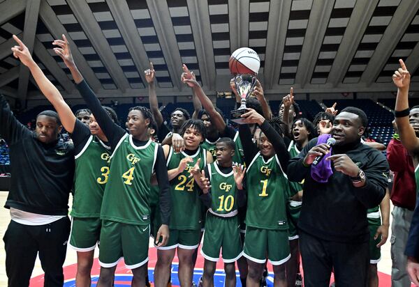 Greenforest's head coach Rory Griffin (right) and players celebrate their win over Manchester during GHSA Basketball Class A Division II Boy’s State Championship game at the Macon Centreplex, Wednesday, Mar. 6, 2024, in Macon. Greenforest Christian won 68-39 over Manchester. (Hyosub Shin / Hyosub.Shin@ajc.com)