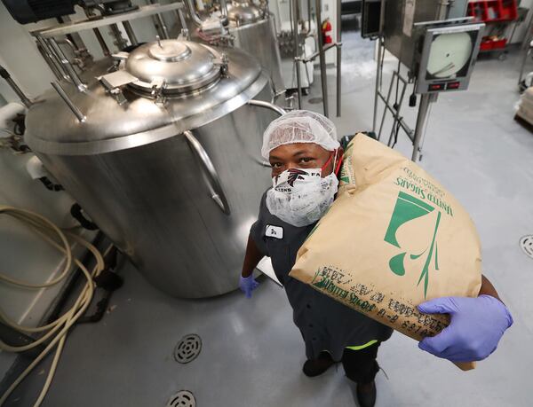 071620 Marietta: Deandre Little “Dre” pauses for a portrait while blending icecream ingredients in the raw room at High Road Craft Brands on Thursday, July 16, 2020 in Marietta.   Curtis Compton ccompton@ajc.com