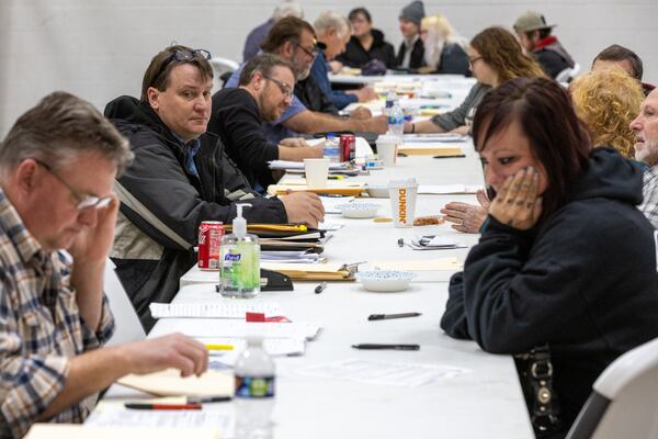 East Palestine residents (right) seek assistance from Norfolk Southern at Abundant Life Fellowship church in New Waterford, Ohio on Friday, February 17, 2023.  (Arvin Temkar / arvin.temkar@ajc.com)