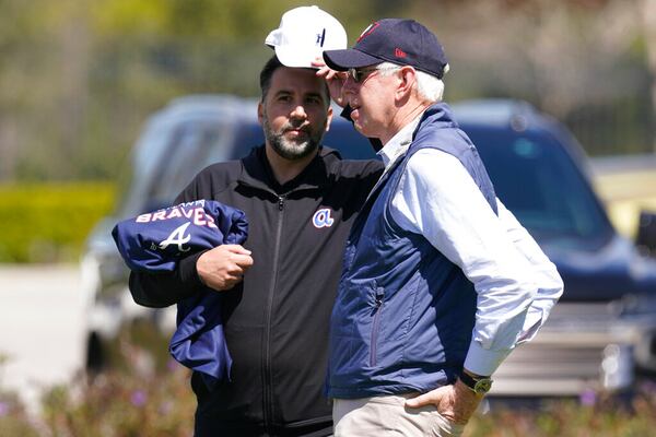 Atlanta Braves general manager, Alex Anthopoulos, left, speaks to Chairman and CEO Terry McGuirk in 2022. (AP Photo/Steve Helber)