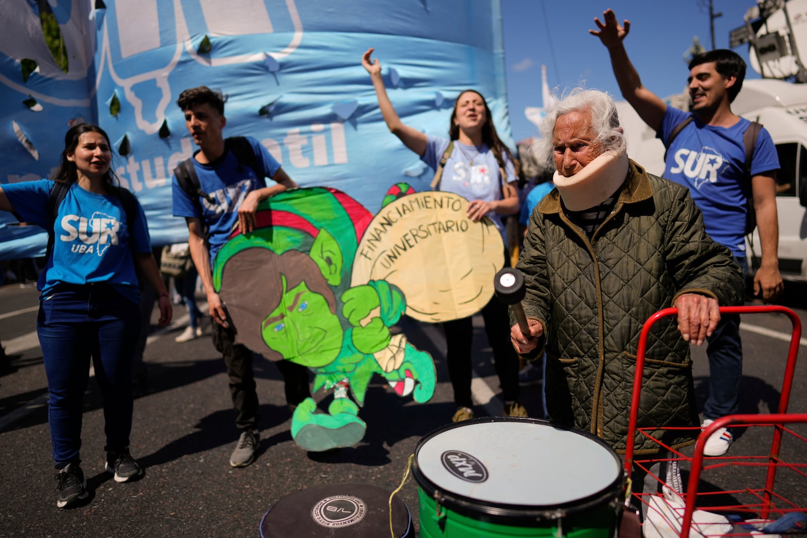 Aidé García, a retiree, joins students protesting outside Congress as lawmakers debate President Javier Milei's veto of a law to increase funding for public universities in Buenos Aires, Argentina, Wednesday, Oct. 9, 2024. (AP Photo/Rodrigo Abd)