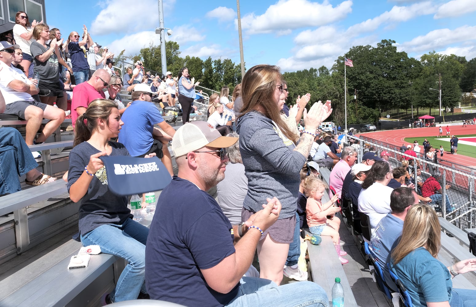 Apalachee fans applaud the team as they leave the field for half time. Apalachee High School returned to the field against Athens Clark Central Saturday September 28, 2024 in their first game since the school schooting earlier in the month.

 Nell Carroll for the Journal Constitution