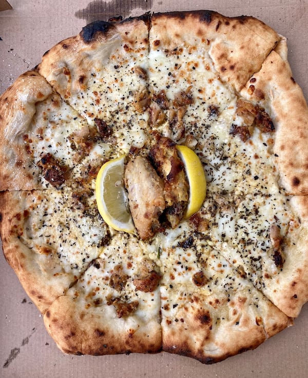 Since creating his original lemon pepper wet pizza last year, Matthew Foster’s ghost pizza kitchen, Phew’s Pies, really has taken off. Wendell Brock for The Atlanta Journal-Constitution