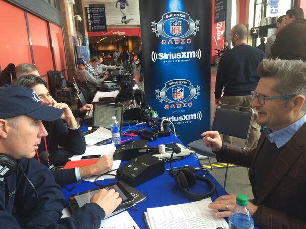 Falcons general manager Thomas Dimitroff doing a radio interview. (By D. Orlando Ledbetter/dledbetter@ajc.com)