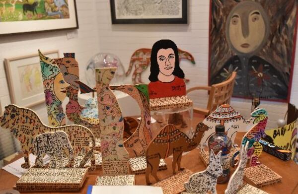 Wood cutout works by Howard Finster on display at Folk America Gallery. HYOSUB SHIN / HSHIN@AJC.COM