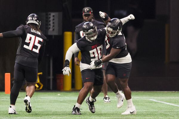 Atlanta Falcons defensive lineman David Onyemata (90) and Grady Jarrett (97) participate in a drill during minicamp at Mercedes-Benz Stadium, Tuesday, June 13, 2023, in Atlanta. (Jason Getz / Jason.Getz@ajc.com)