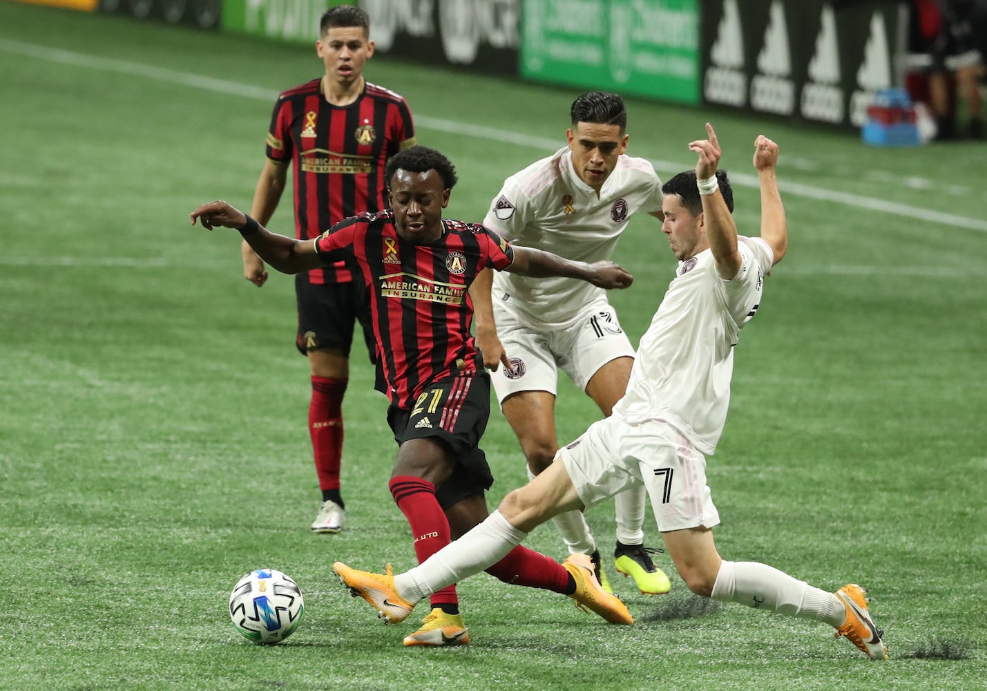 Atlanta United defender George Bello (21) controls the ball against Miami midfielder Lewis Morgan (7) in the second half at Mercedes-Benz Stadium Saturday, September 19, 2020 in Atlanta. Atlanta United lost to Miami 2-1. JASON GETZ FOR THE ATLANTA JOURNAL-CONSTITUTION