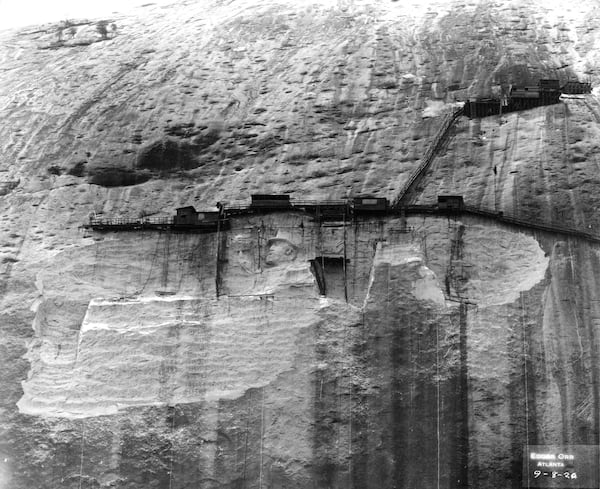 The carving of Confederate leaders looked much different in this 1920s photo than it does today. Borglum's original sculpture was blasted off the mountain and a new design, the existing memorial, was carved.