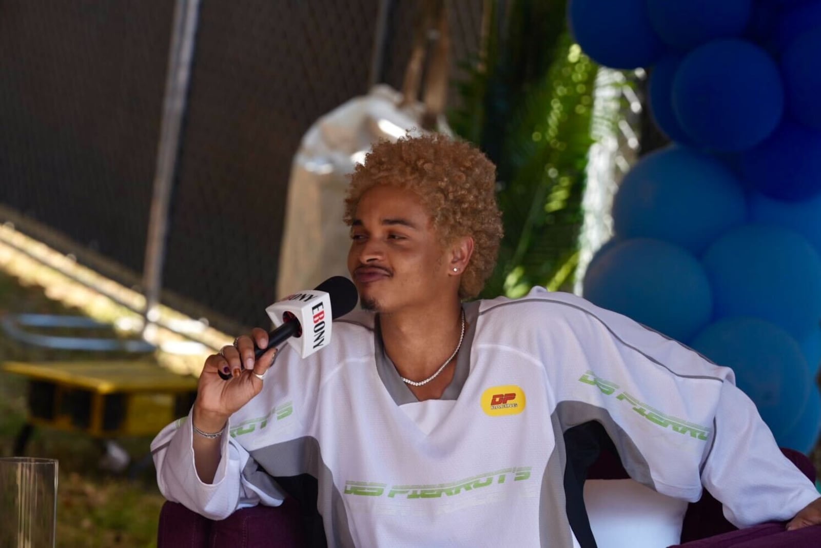 R&B singer Destin Conrad being interviewed in the media tent at One Musicfest Saturday afternoon.